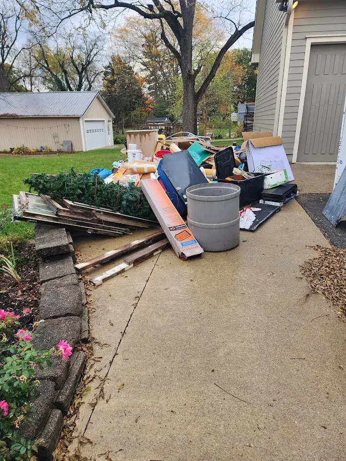 Dumpster being loaded with debris for Commercial Dumpster Rental in Maple Heights